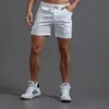 Herr shorts vita spår shorts män tränar elastisk midja knä längd svett shorts joggar män sommar träning fitness gym shorts med ficka 230519