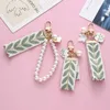 Keychains Elegant Pattern Wristlet Keychain Cute Pearl Shell Pendant With Keyrings and Strap For Women Keys Phones Wallets Decoration