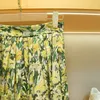 ハーフスカート2023年春の早春の新しい小さなデイジー断片化されたマルベリーシルクハイウエストAラインスカート