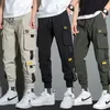 Pantalons pour hommes minces Streetwear pantalons décontractés hommes rubans Harem pantalons de jogging mâle Slim Fit printemps Cargo pantalon multi-poches femmes pantalon Jx1 230519