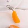 Nova simulação 3D fofa Chave -chave de fruta em PVC laranja para mulheres meninas de fone de ouvido ornamentos de pingente de pingentes de acesso para presentes de bricolage