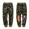 Projektowanie męskie Camo czerwone mężczyźni harem joggers kobieta streetwear swobodny kamuflaż spodnie dresowe belki stóp spodnie rozmiar m-3xl