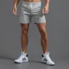Herr shorts vita spår shorts män tränar elastisk midja knä längd svett shorts joggar män sommar träning fitness gym shorts med ficka 230519
