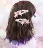 Cravates à la main accessoires de cheveux Style japonais doux perle arc amour coeur pinces à cheveux mignon une paire de pince latérale 230519