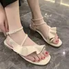 Sandaler kvinnor 2023 Summer Ruffles Solid Open Toe Casual Ankle Buckle Strap Flat Beach Korean Ladies Outdoor Simple Shoes M5