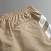 2023 Руд Дизайнер Мужские Шорты Лето модные пляжные брюки Высококачественная таблетка для таблеток короткие натягивания спортивные спортзал мужской эластичная талия