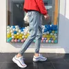 Erkekler Kot Toptan 2023 Moda Elastik Pantolon Yırtık Kiriş Ayakları Gençler Kore İnce Ayak Bileği Uzunluk Harem