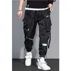 Pantaloni da uomo sottili Streetwear Pantaloni casual da uomo Nastri Pantaloni da jogging Harem da uomo Pantaloni cargo da uomo slim fit multi-tasche Pantaloni da donna K12 230519