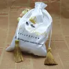 Biżuteria 50pcs luksusowy jedwabny satynowe torby na prezenty prezentowe sznurka do frędzl