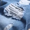 Slanke lichte lichtblauwe mannen kleding sets gescheurd gat 2-delige sets lente herfst herfst spijkerplaats en rechte jeans