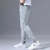 Jeans pour hommes Mode 2022 Stretch Denim Jeans Hommes Printemps Automne Déchiré Rétro Perceuse Chaude Broderie Mince Petits Pieds Bleu Polyvalent Long Pantalon