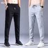 Mäns byxor Summer Men's Casual Pants Thin Soft Soft Elasticity Lace-up midja Solid Color Pocket Applique Korea Gray Black Work Byxor Male 38
