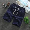 Mens shorts sommar utomhus andningsbar avslappnad strand lös mode träning gym springer män bomull streetwear jogger 230522