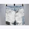 Mäns jeans vår och sommar ny europeisk och amerikansk vattnig tvättbar perforerad tyg kollagen skarvning arbete färg ultra tunna ben elastiska mäns jeans p230522