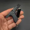 Nyhetsartiklar Portable Toy Gun Model Keychain Alloy Empire Pistol Shape Weapon Mini Shell Ejection Assembly med R230818