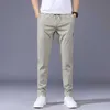 Mäns byxor Summer Men's Casual Pants Thin Soft Soft Elasticity Lace-up midja Solid Color Pocket Applique Korea Gray Black Work Byxor Male 38