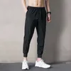 Calça masculina verão fino cintura elástica ao ar livre 2022 Ultra-thin bens de moda masculina Relaxada Perna Casual Track Autumn Youth Khaki Harem Pants P230522