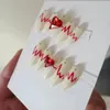 Valse nagels Handgemaakte korte nepnagels met rood hart op nagels gedrukt Y2K lange doodskist fijnkorrelige acryl nepnagels met lijmgift 230617