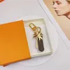 2023 Keychains de designer Skateboard letter Keychain Bag Charm Carro pendente Chavejão de ouro Chain Fashion Mulher Women Key Buckle