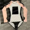 Skriv ut kvinnor bodysuit badkläder lång ärm en bit vadderad baddräkt design mode surfing baddräkt