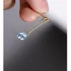 Knot Daimi Sky Blue Topaz örhängen Kvinnliga ädelstenar äkta gul 14K guldinjektion Vind som blåser kort öronlinjeceremoni