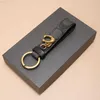Toppskikt Cowhide C Family Keychain för män och kvinnors snygga bilnycklar avancerade väskan hänge läder nyckelring