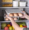 Lagringsflaskor ägg plastbehållare rullar automatiskt av lådor lådor kylskåp arrangörslåda transparent justerbar