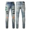 Jeans designer kläder amires jeans denim byxor amies high street mode mens jeans med blått broderi trasig orm hud lapp smal