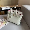 Bag Platinum Litchi Grain Tote echte Leder-Top-Schicht Kuh Leder Handtasche reine Leder Frauen Mode vielseitige Schulterkreuz-Körper Mode