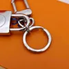 Keychains Lanyards Designer Alloy Keychain Keyring Fashion Purse Pendant Car Chain Charm Bruine Flower Mini Bag Trinket Geschenken Accessoires met Counter Gift Box