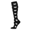 Calcetines de compresión para hombres y mujeres Moda Negro Blanco Calcetines hasta la rodilla Deportes Fútbol Comodidad energizante Alivio de la fatiga Rayas elásticas Medias S / M L / XL