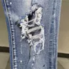 Abbigliamento firmato Amires Jeans Pantaloni denim Amies Tide Brand High Street Jeans traforati con diamanti blu Mens Ins Super Fire Style Pantaloni slim elasticizzati Sci strappato in difficoltà