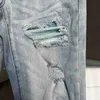 Men's Jeans Designer Clothing Amires Denim Pants Amies 2023 New Light Blue Wash Water Bright Patch Hole Breaking Elastic Slim Fit sHUC4