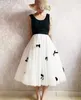 Jupes 2023 Vintage Tulle Jupe femmes élastique taille haute maille perle nœud décoration Midi plissé Tutu femme Jupe Longue