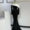 Elegante abito da ballo a sirena bianco nero senza spalline in raso a maniche lunghe con spacco laterale abito da sera per feste di celebrità Robe De Bal