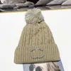 Beanie/Skull Caps Designer chic Warm Wool Ball Hat for Women in Autumn and Winter to Keep Cold Windproof with Flipped Letters Plush Knitted ENMS