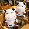 Plush toy, cow doll, doll, sleeping on bed, pillow, cloth doll, cute mascot of the Year of the Ox