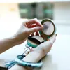 Keychains PU Leather Wristlet Keychain Bangle For Women Bluetooth Earphone Bag Mirror Cosmetic Bags Multifunctional Accessories UKEN