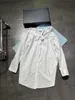Chemisiers pour femmes Chemises designer Printemps / Été Nouveau tempérament détendu Commuting Simplicity Logo Strap décoratif Mini Shirt Dress 2YLU