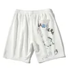 Marca de moda de verano para hombre, pantalones cortos con estampado de grafiti de astronauta, pantalones holgados de tamaño mediano, deportivos, informales, Caprisa