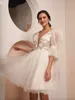 Abiti da sposa a pois corti con maniche a sbuffo Abiti da sposa sexy con scollo a V aperti sul retro Abiti da sposa con applicazioni di pizzo floreale Boho Garden Tulle Spose Abito da festa di secondo ricevimento