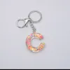 Chaveiros adorável amor pingente de goma de lantejoulas 26 letra inglesa saco feminina acessórios de ponto de presente simples moda de keychain de luxo g230525