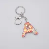 Chaveiros adorável amor pingente de goma de lantejoulas 26 letra inglesa saco feminina acessórios de ponto de presente simples moda de keychain de luxo g230525