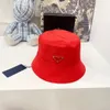 designer hat bucket hats for men European and American P Classic Black Fisherman Hat Metal Classic Inverted Triangle Logo Emblem Unisex Hat