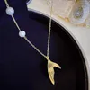 Hänge halsband ursprung sommaruttalande asymmetrisk pärla trumpet svans halsband för kvinnor utsökta festsmycken gåvor