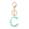 Keychains schattige creatieve kristal aroma stenen brief vrouwelijke ring auto tas charme hanger sleutelhanger g230525