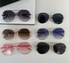 Ny modedesign Kvinnliga fjärilsolglasögon 4260 utsökta metallramskurna lins Enkel och elegant stil utomhus UV400 -skyddsglasögon