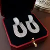 Ciondola gli orecchini Opale artificiale lussuoso Zircone lucido a forma di U Design di fascia alta Accessori moda donna in argento con perno ad ago Commercio all'ingrosso