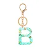 Keychains schattige creatieve kristal aroma stenen brief vrouwelijke ring auto tas charme hanger sleutelhanger g230525