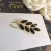Projektanści broszki dla kobiet Pins Pins broszki broszki bozie luksusowe marka broszka retro złoto urocze liście sukienki Pins Akcesoria